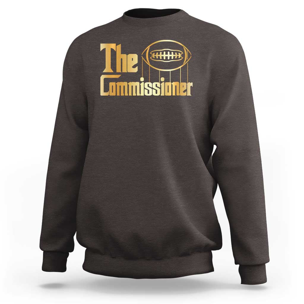 Dark chocolate crewneck sweatshirt with 'The Commissioner' football graphic.