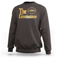 Dark chocolate crewneck sweatshirt with 'The Commissioner' football graphic.