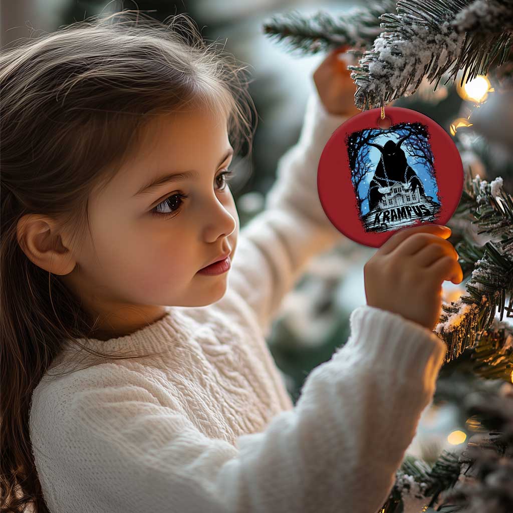 Red circular Krampus ornament held by a child; blue haunted house graphic and gold loop