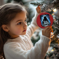 Red circular Krampus ornament held by a child; blue haunted house graphic and gold loop