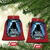 Two red bell-shaped Krampus ornaments with blue haunted house graphic and gold hanging loops