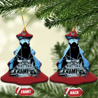 Two red bell-shaped Krampus ornaments with blue haunted house graphic and gold loops