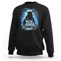 Black crewneck sweatshirt with Krampus night house graphic and blue trees on chest.