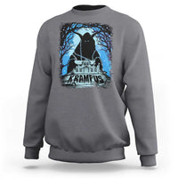 Charcoal crewneck sweatshirt with Krampus night house graphic and blue trees on chest.