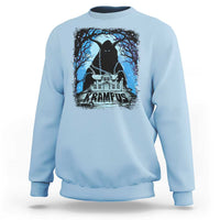 Light blue crewneck sweatshirt with Krampus night house graphic and blue trees on chest.