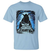 Light blue T-shirt with dark Krampus graphic, blue moonlit trees and house