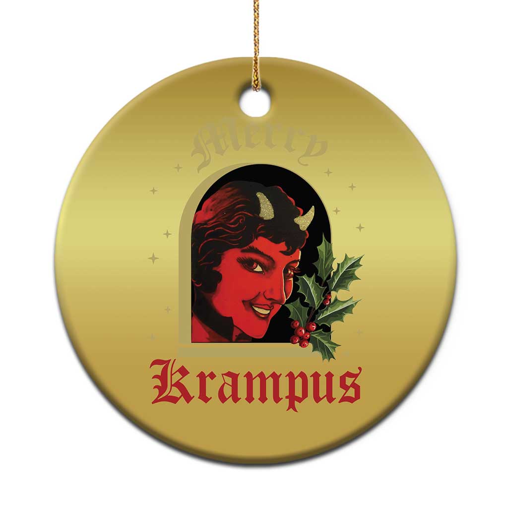 Gold round hanging Christmas ornament with red-and-black horned female face and holly
