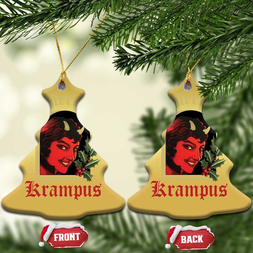 Gold bell-shaped hanging ornament with red-and-black horned female face and holly, two sides