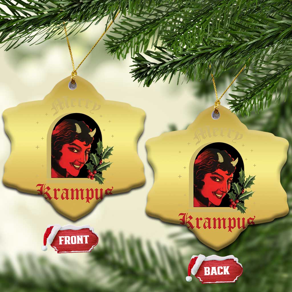 Gold heart-shaped hanging ornament with red-and-black horned female face and holly, two sides
