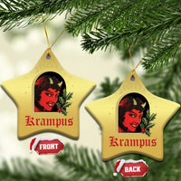 Gold star-shaped hanging Christmas ornament with red-and-black horned female face and holly