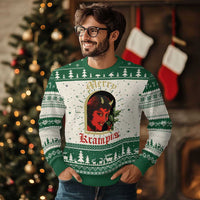 Green ugly Christmas sweater with Krampus face graphic and holiday tree pattern