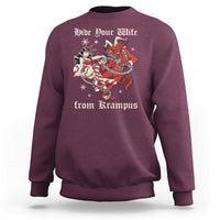 Maroon crewneck Christmas sweatshirt with red Krampus graphic and text 'Hide Your Wife'