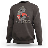 Men's dark chocolate Christmas sweatshirt with Krampus graphic and red text on front