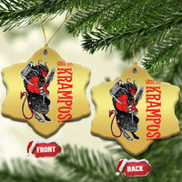 Gold heart-shaped Krampus ornaments with red text and devil figure; two hanging views