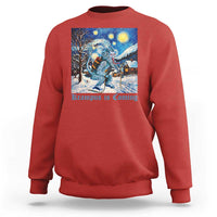 Red crewneck sweatshirt with front winter graphic of Krampus under a starry night