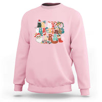 Light pink crewneck sweatshirt with colorful retro Christmas graphic on chest