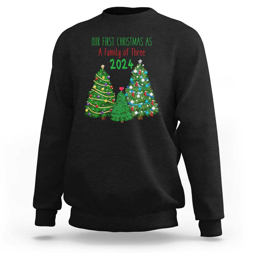 Black Christmas sweatshirt with “Our First Christmas As A Family of Three 2024” graphic