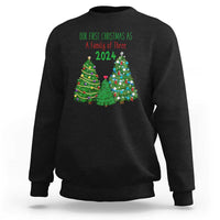 Black Christmas sweatshirt with “Our First Christmas As A Family of Three 2024” graphic