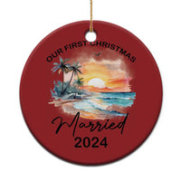 Red round Christmas ornament with “Our First Christmas” and “Married 2024”