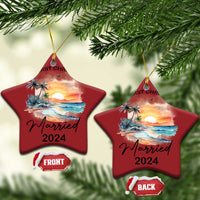 Pair of red star-shaped Christmas ornaments with “Our First Christmas” and “Married 2024”