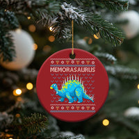 Red round Menorasaurus dinosaur ornament hanging on Christmas tree branches