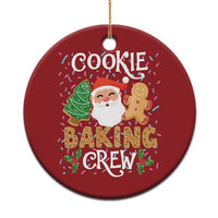 Red round Christmas cookie baking crew ornament with Santa, tree, and gingerbread text.