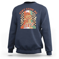 Navy crewneck Christmas sweatshirt with gingerbread boy skateboarding graphic on back
