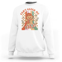 White crewneck Christmas sweatshirt with gingerbread boy skateboarding graphic on back