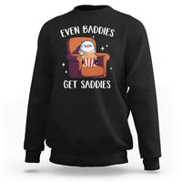 Black sweatshirt with cartoon cat graphic and 'Even Baddies'/'Get Saddies' text