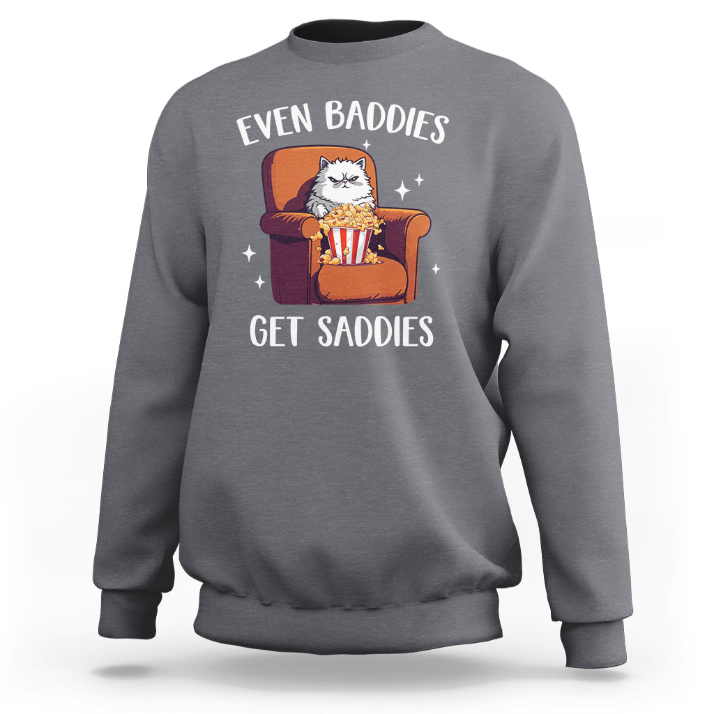 Charcoal gray sweatshirt with cartoon cat graphic and 'Even Baddies'/'Get Saddies' text