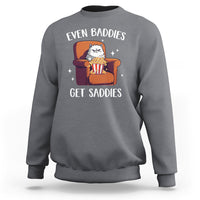Charcoal gray sweatshirt with cartoon cat graphic and 'Even Baddies'/'Get Saddies' text