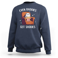 Navy sweatshirt with cartoon cat graphic and 'Even Baddies'/'Get Saddies' text