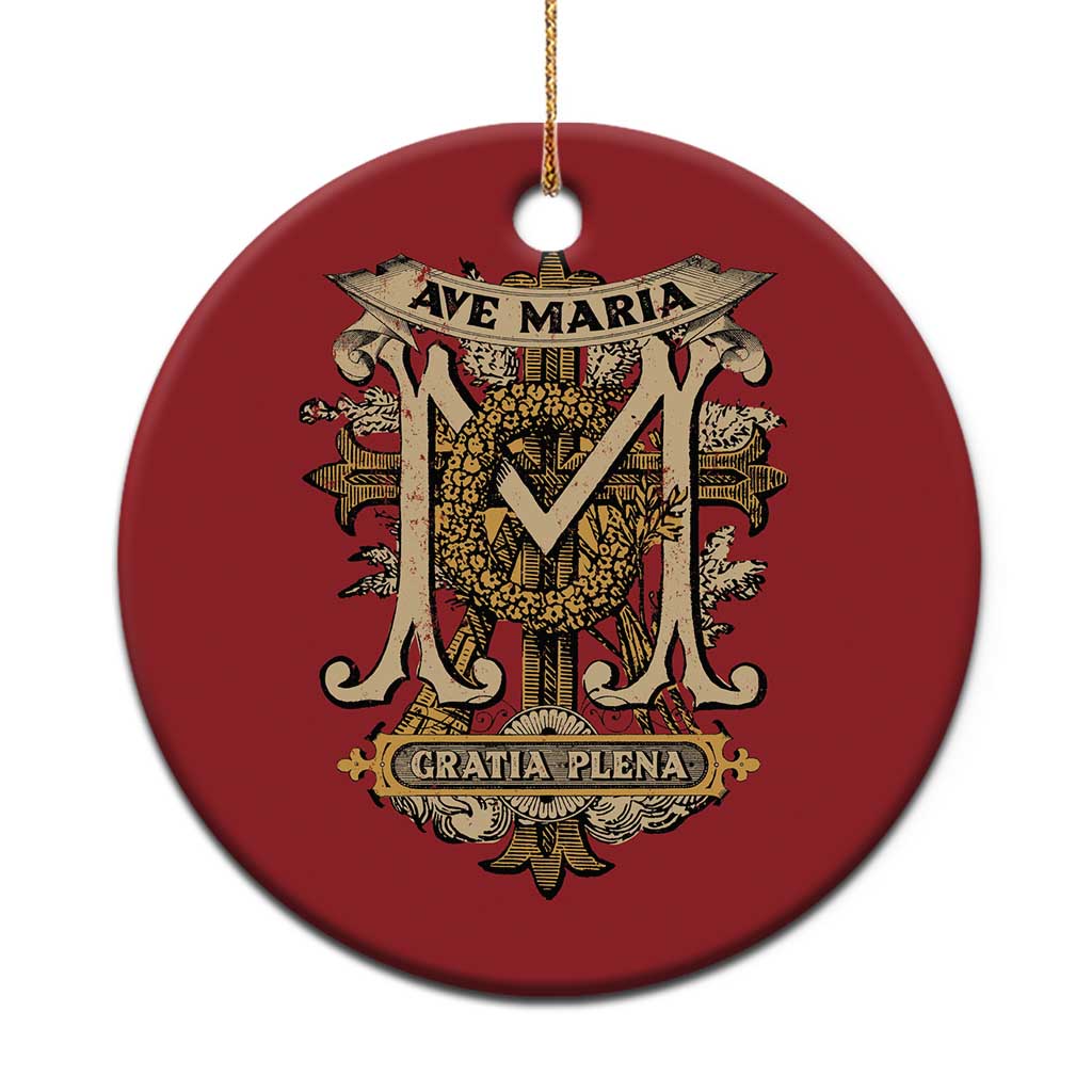 Red round Christmas ornament with gold Ave Maria and Gratia Plena design, hanging loop.