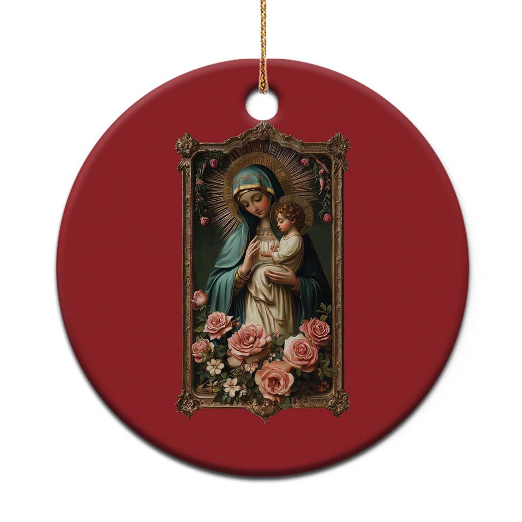 Red round Christmas ornament with Blessed Mother Mary holding baby Jesus and roses
