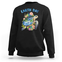Black Earth Day sweatshirt with sea turtle graphic and flowers on the chest