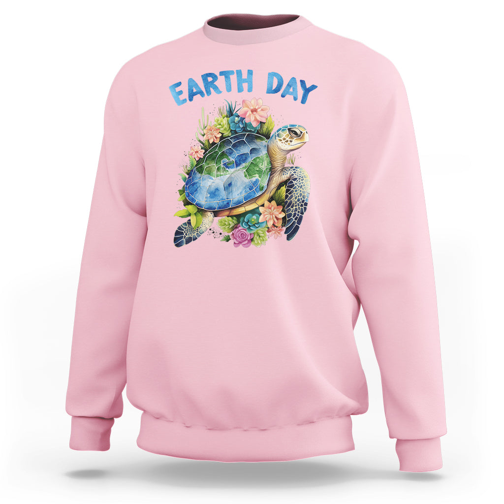 Light pink Earth Day sweatshirt with sea turtle graphic and flowers on the chest