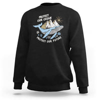 Black sweatshirt with whale graphic and text “Protect Our Ocean, Protect Our Future”