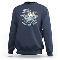Blue sweatshirt with whale graphic and text “Protect Our Ocean, Protect Our Future”