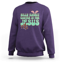 Purple crewneck sweatshirt with colorful Easter rabbit "Easter is for Jesus" graphic.