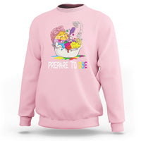 Light pink Easter sweatshirt with 'Prepare to Dye' and colorful egg artwork