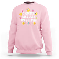 Light pink Easter chicks baby sweatshirt with colorful chick graphic and ribbed cuffs