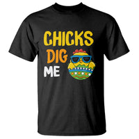 Black baby t-shirt with front graphic text "CHICKS DIG ME" and cartoon chick face