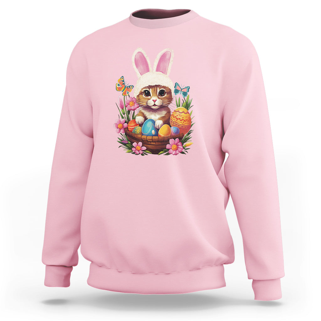 Light pink sweatshirt with colorful Easter bunny cat graphic and eggs basket at chest