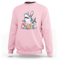 Light pink crewneck sweatshirt with cute shark-and-bunny Easter egg graphic on chest.
