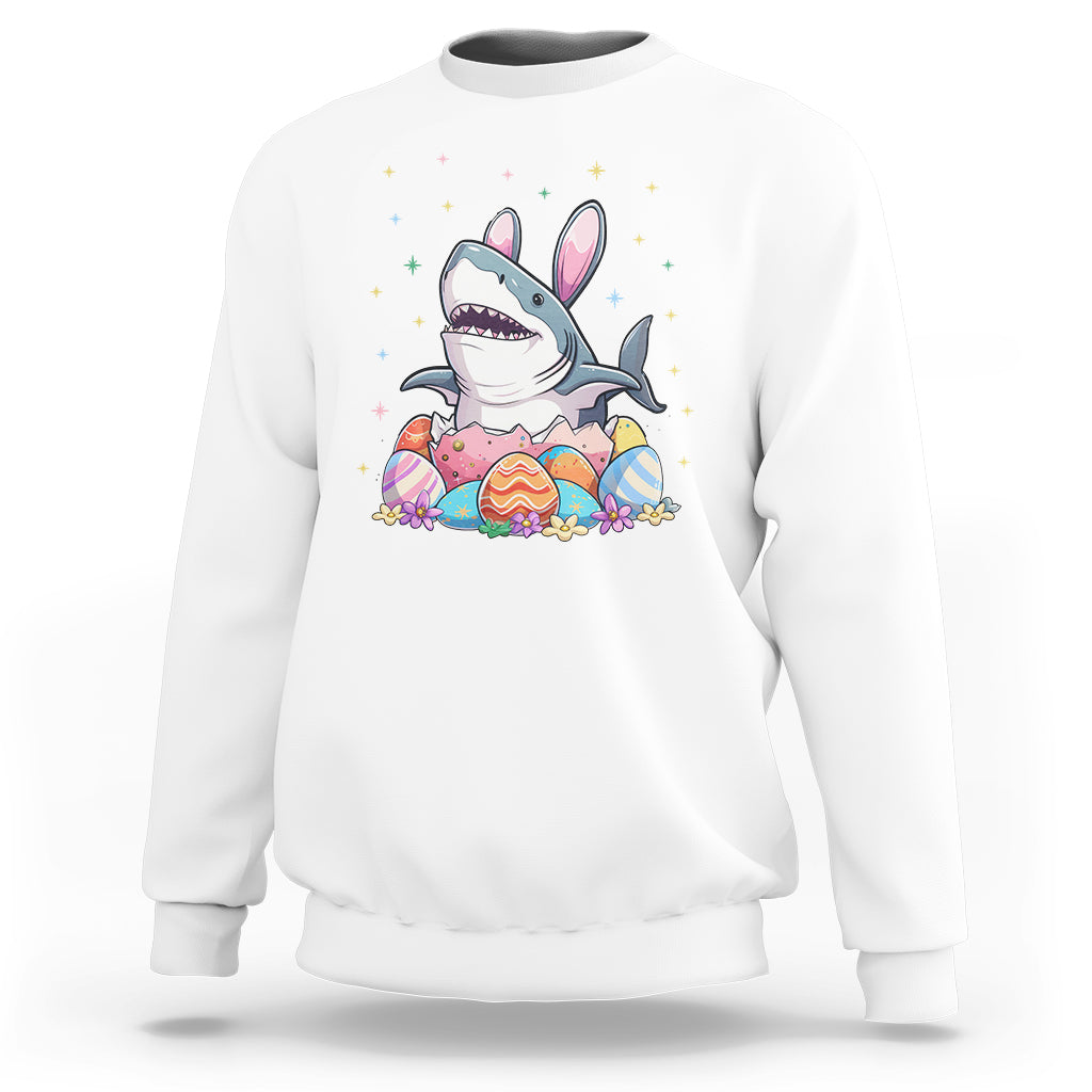 White crewneck sweatshirt with cute shark-and-bunny Easter egg graphic on chest.