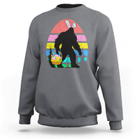 Charcoal crewneck sweatshirt with Bigfoot bunny Easter egg graphic on the front