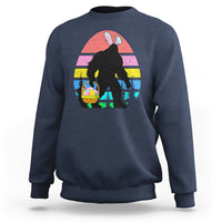 Navy crewneck sweatshirt with Bigfoot bunny Easter egg graphic on the front