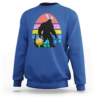 Royal blue crewneck sweatshirt with Bigfoot bunny Easter egg graphic on the front