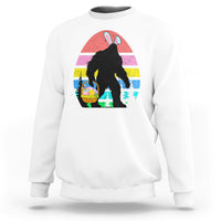 White crewneck sweatshirt with Bigfoot bunny Easter egg graphic on the front