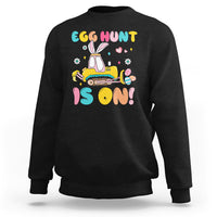 Black Easter egg hunt sweatshirt with bunny tractor graphic and colorful text
